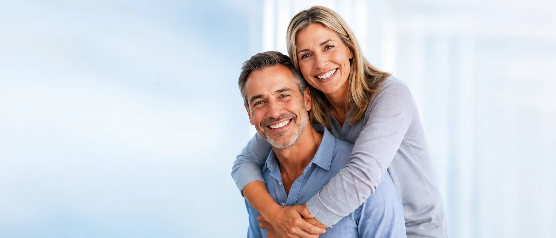 Happy couple smiling Baltimore Implant Center